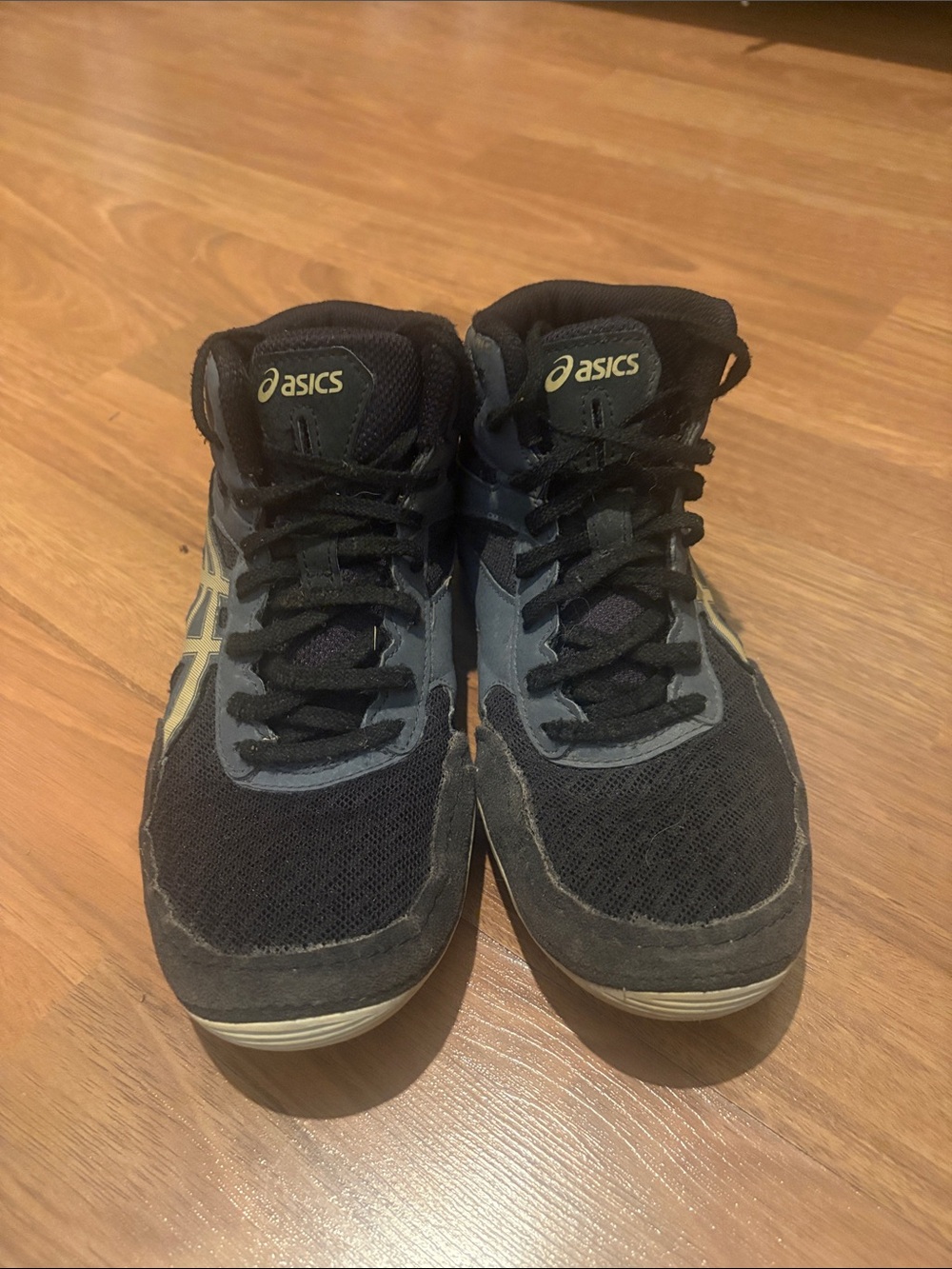 Asics Kids Black, Gray, and Gold Athletic Sneakers with Cream Details